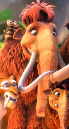 the wooly mammoths are standing next to each other in front of an antelope