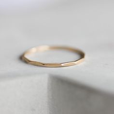 This stacking ring is a simple but yet beautiful jewel for your inner minimalist. It is a gentle and delicate piece, which you may wear alone or stacked. It is a great every-day jewel which will perfectly suit any occasion and any outfit. The ring is 0.8-0.9 mm thick. It's relatively sturdy for such a skinny band. Choose the material for the ring (sterling silver or 9k gold). You may order the ring of any size. If you are not sure about the size, this will be helpful: findmyringsize.com/ If you Minimalist Hammered Stackable Rings, Simple Hammered 14k Gold Rings, 14k Gold Filled Minimalist Stackable Promise Rings, Minimalist 14k Gold Filled Stackable Promise Rings, Minimalist 14k Gold Stackable Rings With Simple Design, Dainty 14k Gold Midi Rings With Diamond Cut, Everyday Minimalist Hammered Midi Rings, Minimalist Stackable Yellow Gold Rings With Diamond Cut, Simple 14k Gold Filled Rings