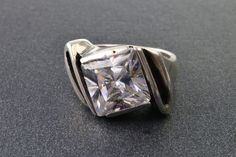 Vintage sterling silver 925 rings with rhinestone square shape.  Ring size 6.  The inner diameter is 16,5 mm.  the size of the stone is 12 x 12 mm.  the weight of the ring is 8.4 gr.   Made in Poland around the 1970-80s.   Good vintage condition. Vintage and antique items sold as-is. This is a unique thing from the last century. It can be a wonderful gift for a special person or for yourself.  It will also be a great addition to your collection.  If you love vintage items, please look in our sho Vintage Silver Rings, Rhinestone Ring, Square Rings, White Rhinestone, 925 Silver Rings, Antique Items, Vintage Sterling Silver, Art Deco Fashion, Vintage Silver