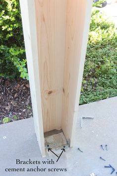 an unfinished wooden door with screws in it