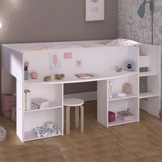 a child's bedroom with a desk and bookshelf