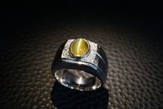 Platinum Diamond Gemstone Men's Ring with 2.23ct Chrysoberyl Cat's Eye  Surrounded by 8 round brilliant cut diamonds total weight 0.08ct Hallmarked and stamped Pt900 and C2.23 D0.08 Ring size is at size N1/2 (US size 6 3/4)  Chrysoberyl Catseye Google translete "Cat's Eye acts to stimulate intuition and to enhance awareness. It is a grounding stone that provides a very effective protective energy. Cat's Eye dispels unwanted energy from the aura. It amplifies good luck and fortune. Chrysoberyl Ca Cat Eye Stone Ring, Cats Eye Stone Ring, Tigers Eye Ring Mens, Tiger Eye Ring, Mens Tiger Eye Ring, Tigers Eye Ring Gold, Cats Eye Ring, Cats Eye Stone, Expensive Watches