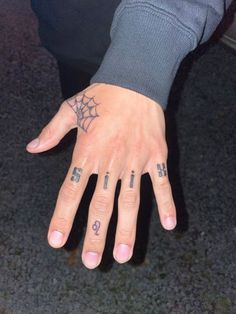 a person's hand with tattoos on it and the word i love you written in small letters