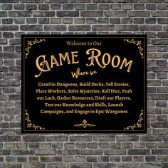 a sign on the side of a brick wall that says game room where we are