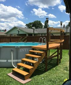 an above ground swimming pool with steps leading up to it and a ladder next to the pool