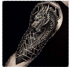 a man's arm with an intricate dragon tattoo on the left forearm and chest