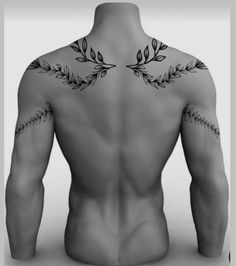 the back of a man's body with tattoos on his upper and lower half