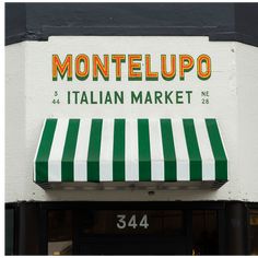 an italian market with green and white striped awning