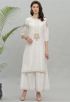 Art Dupion Silk Straight Kurta in White This Readymade attire is Enhanced with Resham and Zari Work and is Crafted in Round Neck and Quarter Sleeve Available with an Art Dupion Silk Palazzo in White Do note: Accessories shown in the image are for presentation purposes only and length may vary upto 2 inches.(Slight variation in actual color vs. image is possible). Diwali Traditional Straight Kurta With Embroidery, Traditional Festive Kurta With Embroidery, Festive Off-white Palazzo Set With Embroidered Border, White Embroidered Palazzo Set For Wedding, Bohemian Long Sleeve Embroidered Palazzo Set, Festive Embroidered Sets For Festivals, White Chanderi Sharara With Floral Embroidery, Off White Embroidered Palazzo Set With Straight Kurta, White Palazzo Set With Intricate Embroidery