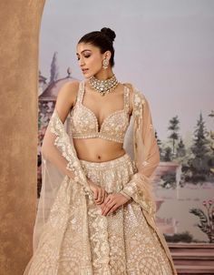 Radiate elegance with this stunning beige lehenga, adorned with a captivating blend of sequins, pearls, gotawork, and intricate cutdana embroidery. The detailed sequined embellishments ensure you shimmer and shine, making it an exceptional choice for your special day. Perfectly crafted for a modern bride, this lehenga beautifully combines tradition with contemporary style, ensuring you make a lasting impression wherever you go. Beige Lehenga, Embroidery Lehenga, Cutdana Embroidery, Lavender Gown, Peplum Gown, Gucci Gown, Cream Embroidery, Custom Gown, Shimmer And Shine