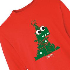 a red shirt with a green christmas tree on the chest and eyes drawn onto it