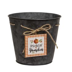 a black bucket with a tag on it that says pickin'pumpkins