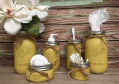 three mason jars with soap and tissues in them