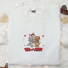 Tom And Jerry Christmas Embroidered Sweatshirt, Movie Merry Christmas Embroidered Shirt, Best Christmas Day Gift Ideas Crew Neck Tops With Machine Embroidery For Gifts, Holiday Embroidered Tops As Gift, Embroidered Christmas Holiday Tops, Christmas White Embroidered Tops, White Tops With Custom Embroidery For Christmas, White Christmas Tops With Embroidered Graphics, White T-shirt With Machine Embroidery For Gift, White T-shirt With Machine Embroidery As Gift, Long Sleeve T-shirt With Machine Embroidery As Gift