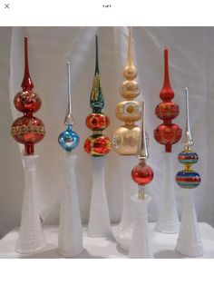 an assortment of colorful glass ornaments on display