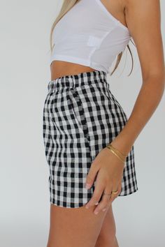 The june gingham shorts couldn't be any cuter. With an elastic waistband and side pockets, comfort and ease are the focus with this shorts. Cut and sewn ethically, in the US, the june gingham shorts will be your go to pop of pattern for a staple look. Stretch Waist Measurements- Small- 26-30 inches Medium- 28-34 inches Large- 30-36 inches Ivy is wearing a size small Care: Tumble dry low or lay flat to dry 50s Diner, Gingham Shorts, Lace Ruffle, Casual Outfit, Short Outfits, Lay Flat, Everyday Fashion, Gingham, Casual Outfits