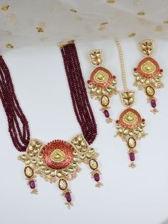 "Indian Traditional Style Gold Polished Necklace Set intricate design graced with beads adorned with amazing clusters for warm classic Royal Design. This Jewelry Set Includes Necklace, Earrings, and Tika. Necklace Length 9\" Approx. Earrings Drop Length 4\" approx." Fusion Chandbali Jewelry Sets For Festivals, Traditional Beaded Sets For Festive Season, Traditional Festive Beaded Sets, Festive Traditional Beaded Sets, Traditional Jewelry Sets With Motifs For Festivals, Traditional Jewelry Sets With Round Beads For Diwali, Traditional Beaded Round Kundan Necklace, Traditional Motif Jewelry Sets For Festivals, Traditional Beaded Jewelry Sets For Festivals