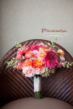 a bouquet of flowers sitting on top of a chair