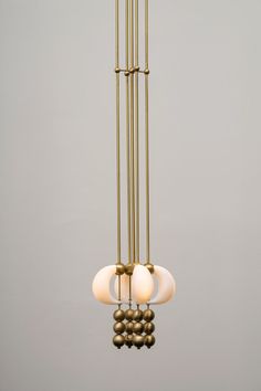 an image of a chandelier with three lights hanging from it's sides