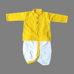 This traditional Indian Beautiful Cotton Katha Work Kurta Pajama Dhoti  Lemon Yellow & White Dress For New Born Kids Infant Traditional Ethnic Wear.  will surely add charm to your cute boy. SALES PACKAGE- 1 Cotton Kurta, 1 Dhoti ( Pant ) Or Pajama ( Pant ) FABRIC-   100 % Cotton Cloth  OTHER DETAILS- This Product Is Good For Your Baby Skin                                    Best Quality And Quick Dispatch                                    It has a soft elastic belt for convenient fitting on the waist. Delivery time ranges between 11 - 18 working days, we provide a Express Shipping Also 5-7 days with Extra charge, You may choose in shipping Option. * You May Conversation With Me if You have any doubt. Thank you so much to visit my shop. Rajesh Bansal owner of Rajasthani Dresses Long Sleeve Bandhani Print Sets For Puja, Traditional Summer Kurta For Ceremonies, Cotton Long Sleeve Churidar For Navratri, Yellow Bandhani Print Kurta For Eid, Fitted Yellow Cotton Salwar Kameez, Yellow Bandhani Print Kurta For Diwali, Cotton Churidar For Navratri With Long Sleeves, Navratri Long Sleeve Cotton Churidar, Cotton Kurta With Traditional Patterns