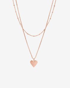 This layered necklace features a dainty shorty chain with a longer chain that has Heart Pendant. Materials: 14K yellow, rose or white gold plated Layered Necklace, Long Chain, Yellow Rose, Layered Necklaces, Heart Pendant, Gold Plate, Plating, White Gold, Rose Gold