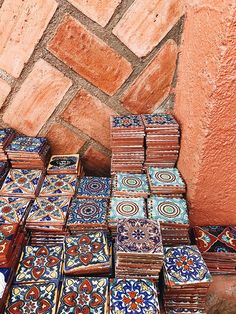 many colorful tiles are stacked on top of each other