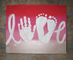 a red and white painting with the word love painted on it