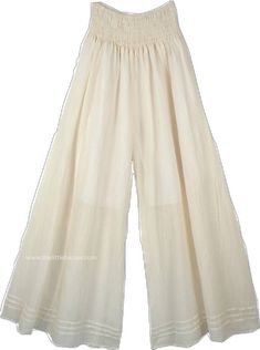 Off White Cotton Wide Leg Pants For Spring, Chic Off White Cotton Wide Leg Pants, Spring Off White Cotton Wide Leg Pants, White Wide Leg Harem Pants For Loungewear, Bohemian White Wide Leg Pants With Elastic Waistband, White Bohemian Wide Leg Pants With Elastic Waistband, Cream Cotton Wide Leg Pants For Spring, Cream Cotton Wide Leg Ankle-length Pants, White Cotton Wide Leg Pants For Summer