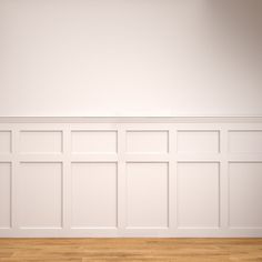 an empty room with white walls and wood flooring is shown in this image, there are no people or objects on the wall