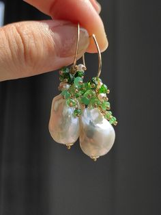 This is a pair of natural Baroque pearls, I decorated them with Tsavorite, green chalcedony, mini pearls, and diopside. The colors slide from dark to light, and the overall look is very elegant. ●Baroque pearl ●high luster Mini Pearls ●green Chalcedony ●Tsavorite ●Diopside ●14K gold filled ●total length approximately:1.8 inches ●weight：5.5g Welcome to visit my Jewelry store: https://www.etsy.com/shop/Ukuly 🌸The delivery time to Most regions of North America, Australia and Europe is usually about 10-15 days. Buyers from Brazil, South Korea, and Indonesia, please provide me with your tax number through messages or notes for smooth shipment. Thank you. 🌸Please let me know your phone number when you place an order. It will be used for shipping label only. 🌸I will pack the goods very careful Pearl Earrings Handmade, Handmade Dangle Earrings, Dangle Earrings Gold, Polymer Earrings, Earrings Handmade Dangle, Green Chalcedony, Baroque Pearl Earrings, Color Gradient, Shipping Label