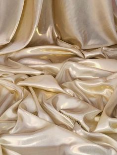 "Shimmer satin fabric :- shiny wet look satin fabric  cream/gold in colour  its colour is cream and has gold shimmer on it width is 58\" inches(147cm) soft feel medium weight smooth shiny fabric  can be used for multiple projects dresses,crafts,wedding,upholstery,bedding,table tops ,curtains,costumes, cushions etc this price is for one meter and if you will buy more than one meter it will come as one continuous length  please note that we try our best to get the actual colour of the fabric but b Satin Aesthetic, Camera Effects, Upholstery Bed, Shiny Fabric, Craft Wedding, Gold Satin, Gold Fabric, Dress Crafts, Wet Look