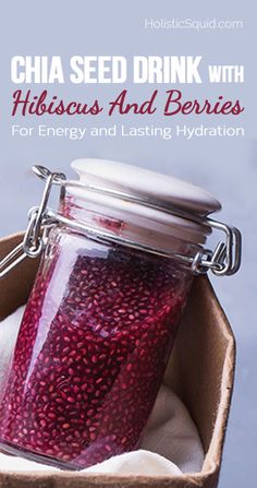 a jar filled with red liquid sitting on top of a table