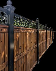 a wooden fence with wrought iron work on it