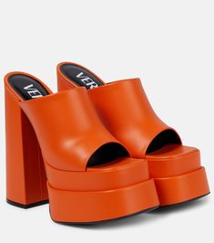 Leather platform mules in orange - Versace | Mytheresa Orange Platform Sandals, Orange Outfit Aesthetic, Orange High Heels, Versace Leather, Shoes Aesthetic, Orange Heels, Fashion Newsletter, Platform Mules, Versace Shoes