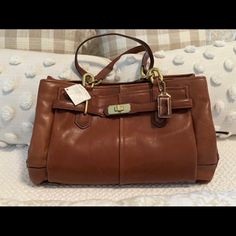 Brand New Never Used Coach Leather Purse Elegant Cognac Shoulder Bag, Classic Tote Bag With Branded Hardware, Classic Bags With Branded Hardware For Shopping, Office Tote Satchel With Branded Hardware, Cognac Rectangular Bag With Branded Hardware, Cognac Bag With Gold-tone Hardware For Shopping, Cognac Tote Satchel With Branded Hardware, Classic Tote Satchel With Branded Hardware, Travel Tote Satchel With Branded Hardware