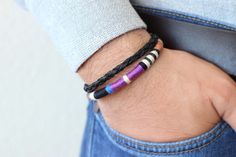 A modern leather bracelet featuring hand-woven leather cord in blue, purple, off-white and black. Finished with a secure magnetic clasp in matte black. Details: - Genuine leather cord in brown - Woven leather cord - Wool & cotton - Secure magnetic clasp in matte black For additional information, please feel free to contact us. Handmade Modern Black Braided Bracelets, Handmade Modern Black Braided Bracelet, Handmade Modern Wrap Bracelet As Gift, Modern Handmade Wrap Bracelet As Gift, Modern Handmade Wrap Bracelet For Gift, Handmade Modern Wrap Bracelet Gift, Modern Purple Bracelet As Gift, Modern Blue Leather Bracelet Gift, Black Bohemian Leather Bracelet For Everyday