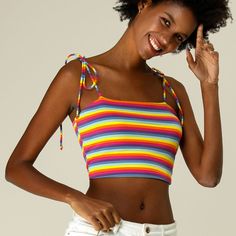 This feminine beach cropped top is styled with charming multicolor stripes and tie shoulder straps. A stretchy slim top that also makes a cute underlayer for streetwear boasts a riveting rainbow of stripes. A chic fashion and now an essential for today, this cami top is made from a soft, stretchy knit jersey with spaghetti straps for a comfortable fit. Trendy Striped Crop Top Tank, Trendy Rainbow Sleeveless Top, Trendy Striped Sleeveless Crop Top, Trendy Strappy Tank Top For Beach, Vacation Crop Top With Spaghetti Tie Straps, Trendy Strappy Tank Top For Summer, Multicolor Camisole Crop Top, Summer Striped Tops With Tank Straps, Multicolor Fitted Tops With Adjustable Straps