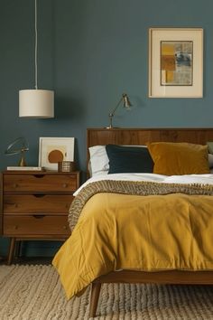 a bedroom with blue walls and yellow bedding