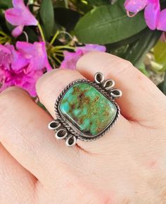 Vintage native american made sterling silver and turquoise ring. Size: 7.5 Gemstone: Genuine turquoise measuring 19mm x 16mm  Metal Content: Sterling silver unmarked, tested Measurements: 22mm tall by 29mm wide. The shank measures 3mm wide. Weight: 7.5 grams Condition: Very good condition with minor wear commensurate with age and original patina left intact. Western Green Turquoise Ring In Sterling Silver, Untreated Southwestern Turquoise Ring For Anniversary, Native Jewelry, Genuine Turquoise, Vintage Turquoise, Ring Size 7, Turquoise Sterling Silver, American Made, Rings Statement