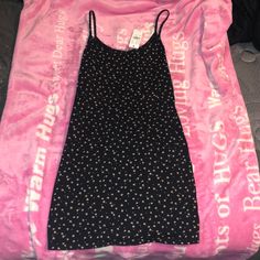 Brand New With Tags, Brandy Melville Dress Bought From Pacsun. The Dress Is In New Condition And Is Black With Little Yellow/Red/Green Flowers On It! It Is Tight Fitting At The Top But Not So Much At The Bottom Which Makes It Rly Cute!!! It Has Tank Top Straps And Is One Size. Black Fitted Sundress For Summer, Black Mini Dress With Spaghetti Straps For Spring, Black Knee-length Sundress Mini Dress, Spring Black Cotton Mini Dress, Black Fitted Mini Sundress, Black Cotton Mini Dress For Spring, Black Fitted Knee-length Sundress, Black Mini-length Summer Dress, Black Mini Length Summer Dress