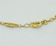 "This necklace is in absolutely fabulous condition. It is of French origin, crafted from 18 karat solid yellow gold. The Necklace features a completely hand crafted chain and very very fine goldsmith work on the plaques. There are seven plaques in total, each one with finely twisted gold rope and a finer twist in the center of each. The plaques feature 13 natural seed pearls. Each pearl is drilled and pinned and in fine condition. The swag is a double chain with a seed pearl at the base of each Formal 22k Gold Chain Necklace, Formal Yellow Gold Chain Necklace With Round Pendant, 22k Yellow Gold Chain Necklace For Formal Occasions, Formal Yellow Gold Chain Necklace With Spring Ring Clasp, Elegant 22k Gold Link Necklaces, Formal Engraved Gold Chain Necklace, Formal 22k Yellow Gold Chain Necklace, Luxury 22k Gold Engraved Necklace, Formal Yellow Gold Hallmarked Chain Necklace