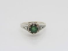 Vintage Sterling Silver Emerald Filigree Ring ....Marked 925...Total of weights 2.9grams....Size 6....Measure of stone 5.1MM...Its in very good condition. Engraved Sterling Silver Emerald Ring, Engraved Sterling Silver Round Emerald Ring, Engraved Round Emerald Ring In Sterling Silver, Vintage Silver Rings, Solitaire Rings, Green Opal, Filigree Ring, Silver Filigree, Opal Rings