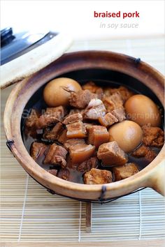 a wooden bowl filled with meat and eggs