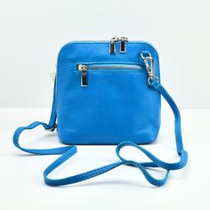 Presenting our colorful, petite, Italian leather crossbody bag, Contessina. This compact handbag is great to bring along while traveling and keeps you light and carefree. The Contessina is a portable, crossbody bag to store your everyday essentials. With it's vibrant colors and high-quality Italian leather, you will not regret adding this wonderful bag to your collection! Eco-Friendly Vegetable Tanned Top Grain Leather Made in Florence, Italy 6.5" tall and 7 wide Two-way outside zipper Fabric Li Orange Zipper Closure Crossbody Shoulder Bag, Murano Glass Mirror, Blue Crossbody Box Bag With Gold-tone Hardware, Blue Crossbody Shoulder Bag With Gold-tone Hardware, Orange Leather Shoulder Bag With Gold-tone Hardware, Yellow Lime, Gold Starburst, Orange Crossbody Shoulder Bag With Gold-tone Hardware, Italian Bags