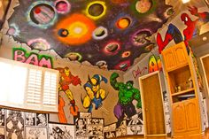 a room with comic themed walls and ceiling