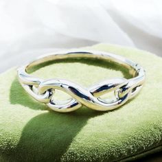 Elevate your accessory collection with our exquisite 925 Sterling Silver Infinity Bangle Bracelet. This sophisticated piece features a spring hinge for effortless wear and is designed to provide both style and comfort. With a delicate weight that ensures ease of movement, this bangle boasts an inside circumference of 6.5 inches or 16.5 centimeters, making it a perfect fit for a variety of wrist sizes. Each bangle is meticulously crafted and bears the hallmark "925," signifying its authenticity a Silver Bracelet With Modern Twist For Anniversary, Sterling Silver Hinged Bracelet For Gift, Sterling Silver Hinged Jewelry Gift, Sterling Silver Hinged Jewelry For Gifts, Unique Birthday Ideas, Infinity Design, Birthday Idea, Spring Hinge, Anniversary Gift For Her