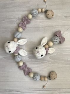 a crocheted bunny and wooden bead necklace