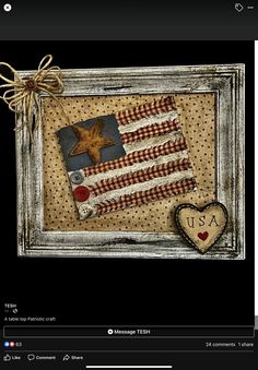 an american flag is hanging on the wall next to a heart and star shaped cookie