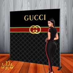 a woman standing in front of a gucci sign