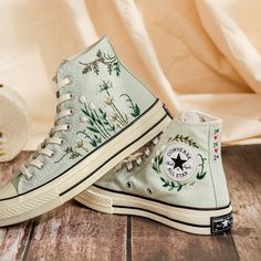 Customized Embroidered Converse High Tops, Flower Embroidered Sneakers for Women, Personalized Converse, Wedding Sneakers for Bride, Handmade Gift 💚 Immerse yourself in the intricate craftsmanship as we lovingly hand embroider rustic flowers onto your chosen Converse pair 💚 🌿 The listed price encompasses both the Converse Shoes and the showcased Embroidery Designs. 1. MANUFACTURING PROCEDURE 🌿 Upon receiving your order, we initiate the shoe preparation process. If your chosen shoes are readi Sage Green Converse Embroidery, Embroidered Low-top Canvas Shoes For Spring, Spring Embroidered Low-top Canvas Shoes, Spring Wedding Embroidered Sneakers, Low-top Sneakers With Multicolor Floral Embroidery, Embroidered Sneakers For Spring, Embroidered Closed Toe Sneakers For Spring, Spring Embroidered Sneakers, Spring Wedding High-top Sneakers